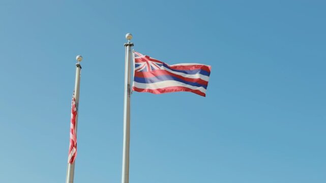 The former flag of the Kingdom of Hawaii, now the flag of the State of Hawaii.  Puʻukoholā Heiau National Historic Site,  The Big Island (Hawaiʻi Island).