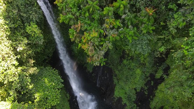 Drone View of Wonderful Hidden Pete Waterfall in Tropical Forest, Central Java Indonesia