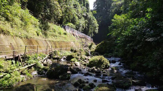Drone View of Wonderful Hidden Pete Waterfall in Tropical Forest, Central Java Indonesia
