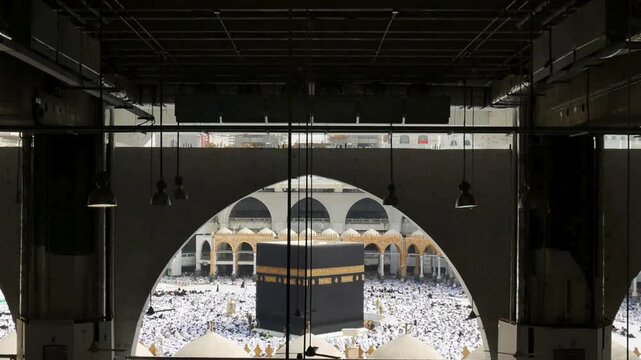 Stunning view of Holly Kaaba in Masjid Al Haram framed by architecture during Hajj pilgrimage
