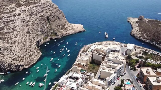 Aerial vertical view of Xlendi Bay and historic tower in Gozo Malta. oil transportation and ocean ways , 