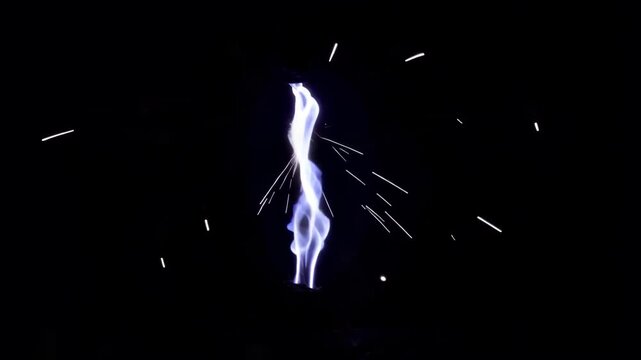 Electric spark with sparks flying around in the dark