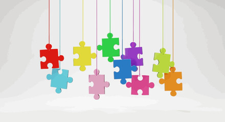 Fototapeta na wymiar Colorful puzzle pieces hanging from strings on a light gray background