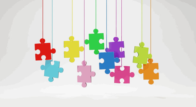 Colorful puzzle pieces hanging from strings on a light gray background
