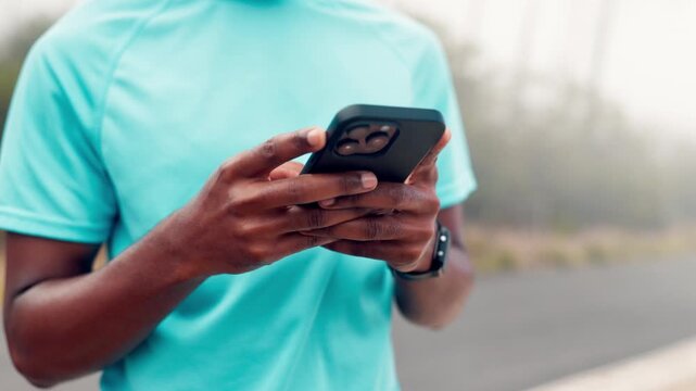 Hands, outdoor or man with fitness, cellphone to track progress or typing for message. Person, scroll or runner in street, exercise for health benefit or digital app for training schedule or internet
