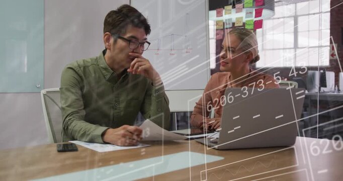 Man pointing at laptop, woman typing, data overlays aligning with papers, ending business review