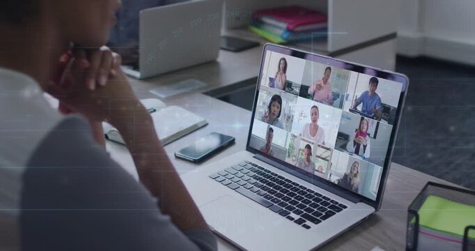 Woman seated listening and nodding to follow business discussion as laptop 3x3 grid team speaking