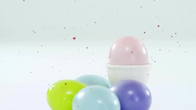 Timed entrance revealing pastel eggs settling on white table, heart confetti drifting for marketing