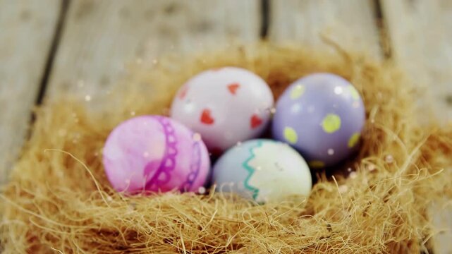 Camera pulling back, revealing straw nest with four pastel eggs, sparkles drifting for Easter ad