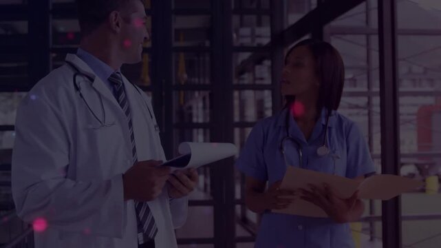 Doctor glancing, turning to nurse near glass wall, checking patient folder while flares over docs