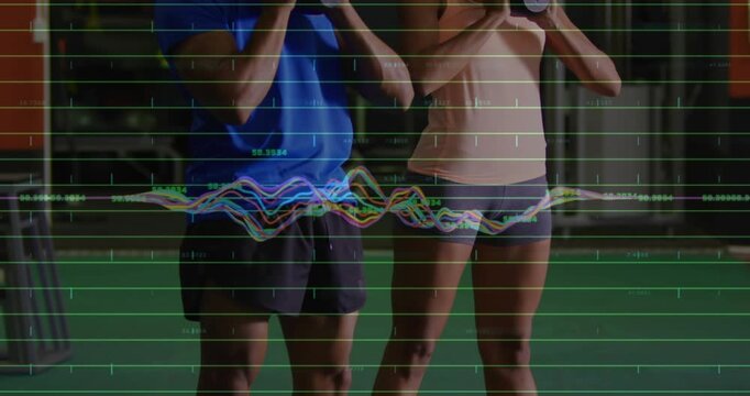 Man woman partners descending into goblet squats on gym turf waveform syncing to depth for fitness