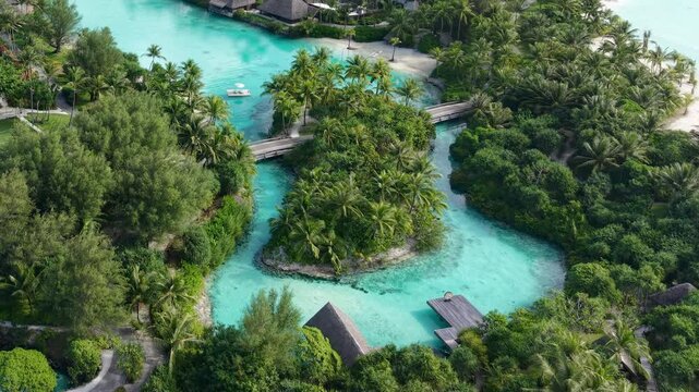 Luxury Resort on Bora Bora Island, French Polynesia, Drone Shot of Lagoon, Buildings and Tropical Lush