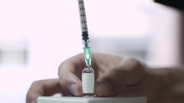 Syringe Drawing Medicine from Glass Ampoule with VFX Tracking Markers for Label Replacement