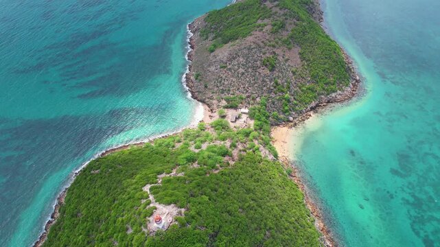 Aerial view backwards with the camera revealing the ilheu das cabras with S&atilde;o tom&eacute; coast at background,Africa
