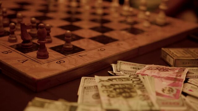 Cinematic close-up of chessboard strategy beside scattered dollar and euro banknotes symbolizing financial strategy, risk, investment planning, wealth competition and power in business decision making