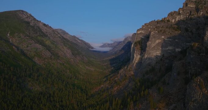 Wide canyon view with towering granite walls in Bitterroot Range Montana