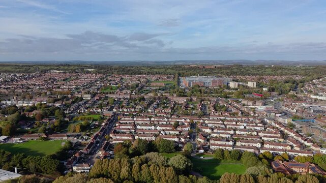 Portsmouth Uk high forwardd drone footage over terraced houses flying inland on bright sunny day.Detailed urban view