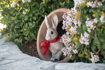 Naklejka premium Rabbit easter garden decor. Rabbit cute holiday decoration. Rabbit spring festive symbol. Rabbit playful seasonal ornament.