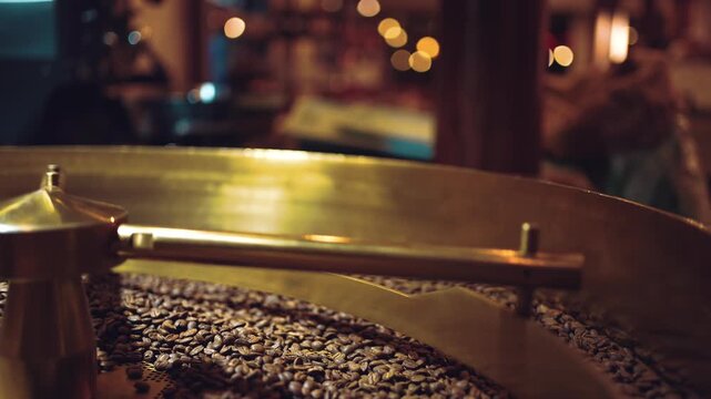 coffee beans roasting process closeup, professional roaster machinery equipment roast brown and golden colored cafe seeds close-up 4k