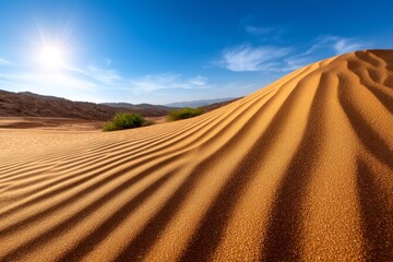 Wind Carving Sand Into Ribbons Amidst Dunes Under Bright Blue Sky with Sunlight