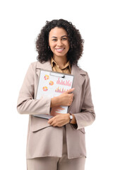 Young African-American businesswoman with diagrams on white background