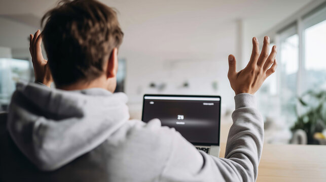 Man raising hands in exasperation, looking at slow loading laptop screen, showing technology problem and inefficiency