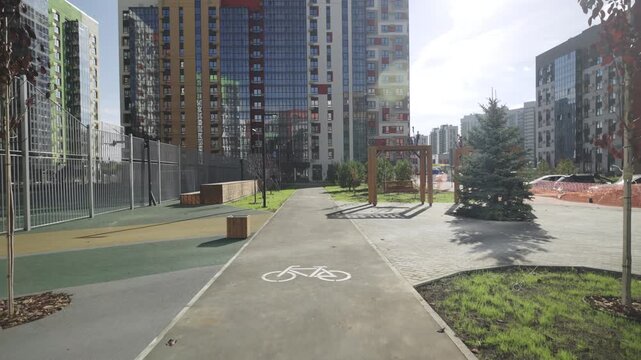 Courtyard of modern residential complex features dedicated bicycle lanes. Organized territory supports mobility sustainable urban lifestyle