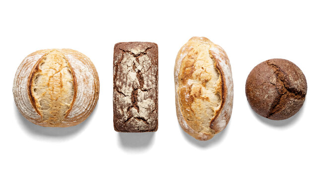 four different types of bread, including a round loaf, a rectangular loaf, a long loaf, and a small round loaf, arranged horizontally against a white background. bread photography.