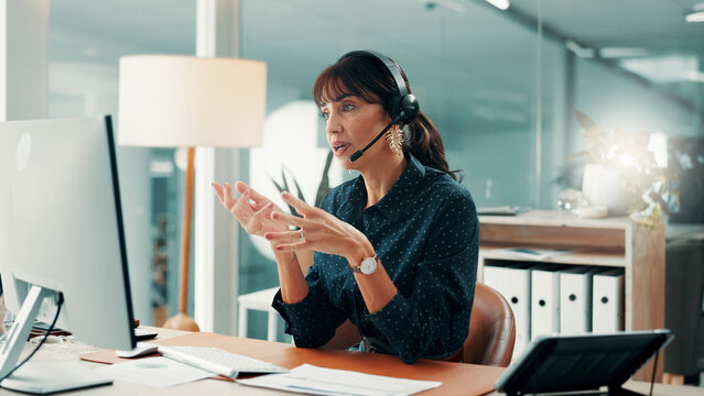 Woman, consultant and headset with computer in office for online advice or virtual assistance. Female person, agent or employee with mic for communication, discussion or conversation in call center