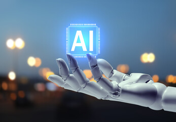 Robot hand holding virtual AI chip against blurred background. Artificial intelligence concept