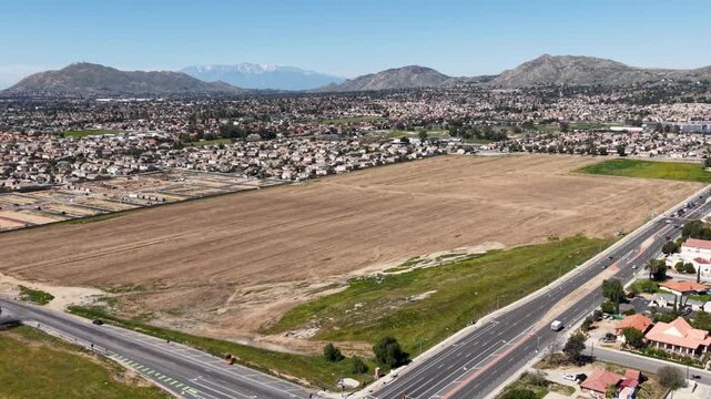 High Altitude flyaway shot of vacant land in California using a Drone