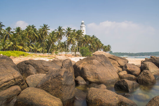 Lighthouse on a Rocky Beach Landscape Along the Coast of Sri Lanka