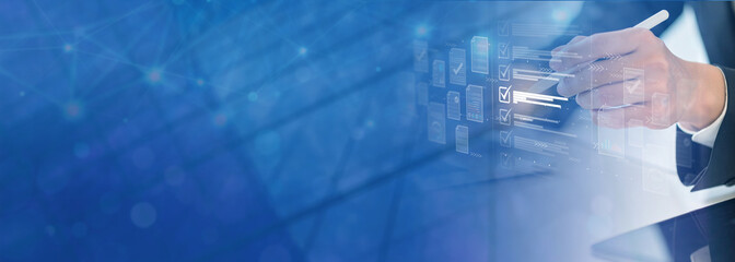 Businesswoman checking business performance using computer; monitoring concept with online survey filling out and digital form checklist.