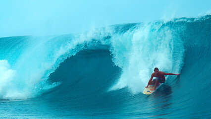 CLOSE UP: Cool surfer drags his hand through the refreshing ocean while surfing. © helivideo
