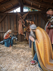 Naklejka premium Traditional Wooden Nativity Scene With Mary Joseph And Angel, Bolzano, Italy