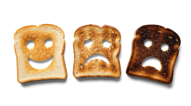 three toast slices with carved faces depicting joy, sorrow, and extreme charring, set against a transparent background.