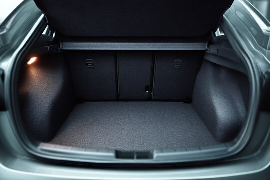 Open car boot providing ample empty space for luggage