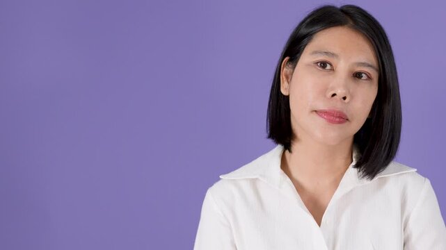 Asian Woman Looking Up with Discontent and Serious Expression