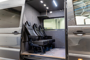 Passenger seats installed inside customized transport van