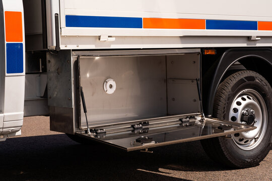Open storage compartment on specialized service truck.