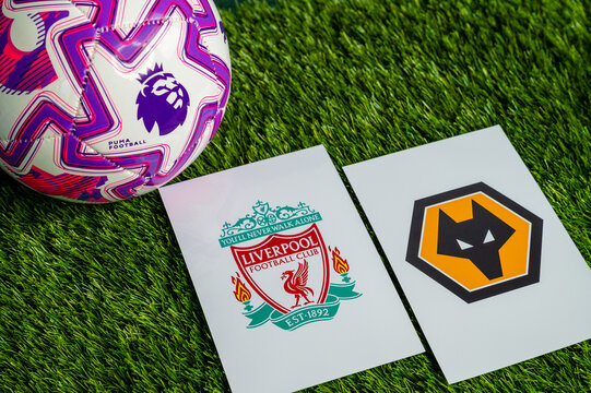 Liverpool vs. Wolverhampton Wanderers English Premier League matchup, team logos and football ball on green grass