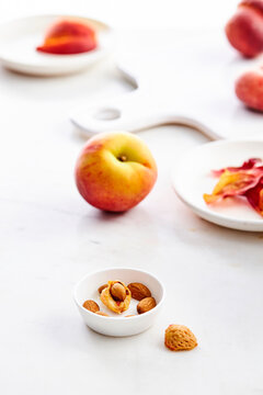 a peach on a marble surface
