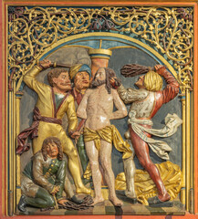 Obraz premium Salzburg - The detail of Flagellation from carved polychrome late Gothic altar in the church of Benediktinerinnenabtei Nonnberg probably by Veit Stoss (1445–1533)