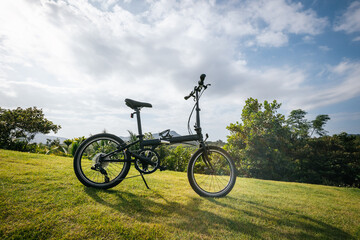 Fototapeta premium Folding bike on tropical mountain top