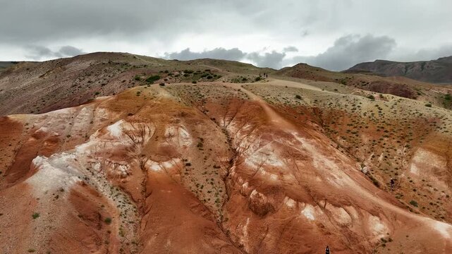 Aerial view Tourist on Altai landscape republic Russia. Red color sand and clay Mars Altay.