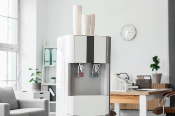 Modern water cooler in light office
