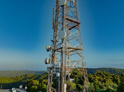 Aerial view of the Waiatarua television transmitter tower, Auckland, New Zealand. The tower transmits television and radio signals across the region.