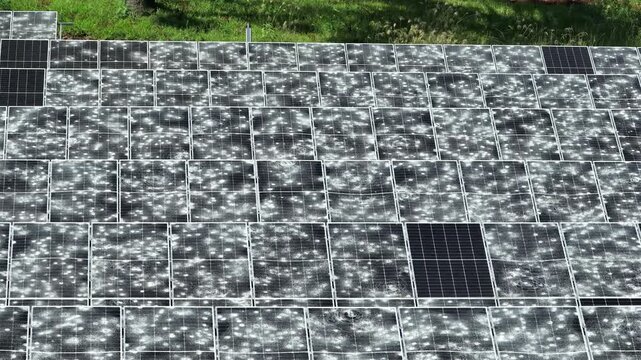 Solar panels show severe hail damage in lateral parallax view, revealing widespread impact marks, shattered surfaces and renewable infrastructure risk.