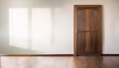 Fototapeta premium simple light filled room with a closed wooden door