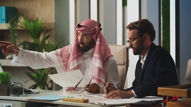Arab and European partners discussing business deal, international cooperation